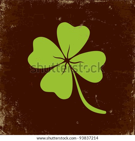 Clover with four leaves in brown background Royalty-Free Stock Photo #93837214