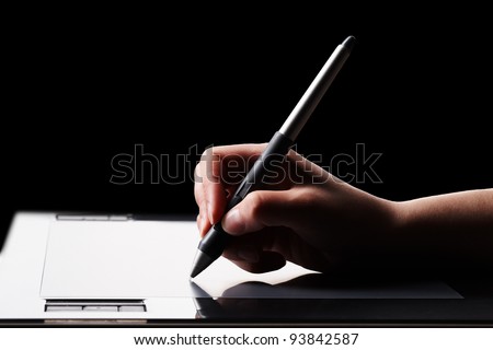 Graphic tablet and hand Royalty-Free Stock Photo #93842587