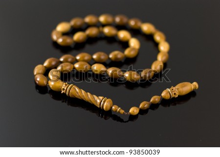 beads made ??of wood on a black background