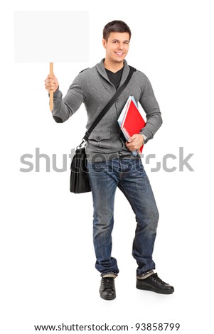 Smiling young student holding a white empty banner isolated on white background