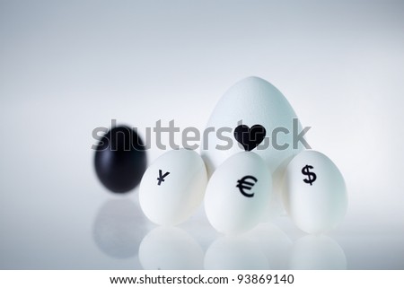 Image of big white egg with heart surrounded by three small eggs with currency signs