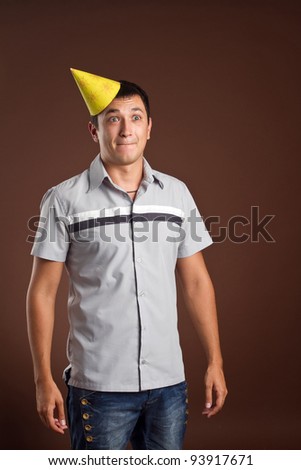 An image of a man in a yellow cap