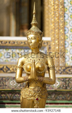 Ornate golden temple guard in the Grand Palace Bangkok Thailand
