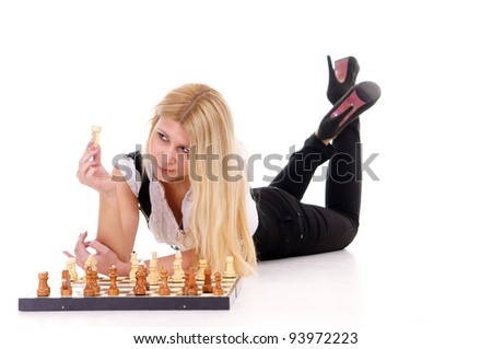 cute blonde playing chess on a white