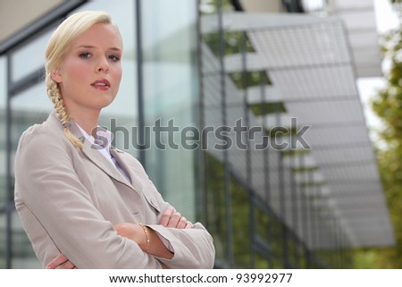 Young confident business woman stood outdoors