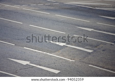 Arrow signs as road markings on a street with six lanes Royalty-Free Stock Photo #94052359