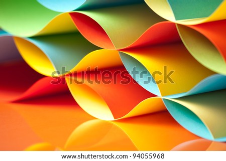 background macro image of colorful origami pattern made of curved sheets of paper, with mirror reflexion Royalty-Free Stock Photo #94055968