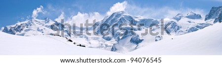 Panorama of Snow Mountain Range Landscape with Blue Sky at Matterhorn Peak Alps Region Switzerland Royalty-Free Stock Photo #94076545