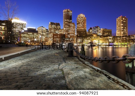 View of Boston Harbor and Financial District in Boston, Massachusetts at Dusk.