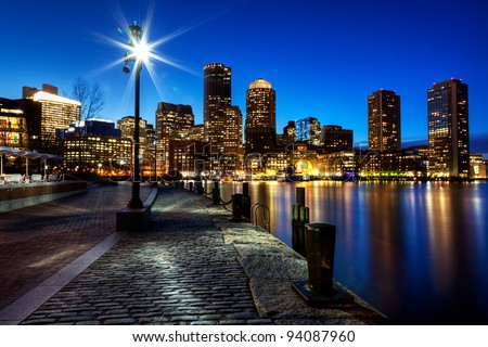 Boston Harbor and Financial District in Boston, Massachusetts at Sunset.