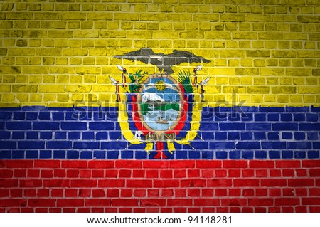 An image of the Ecuador flag painted on a brick wall in an urban location