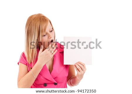 Young woman pointing at blank card in her hand