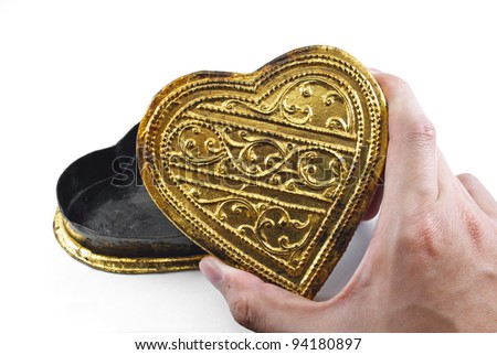 Hands holding golden heart, white background