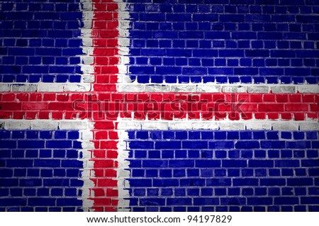 An image of the Iceland flag painted on a brick wall in an urban location
