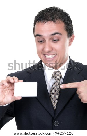 A smiling businessman holds out a credit card on white background
