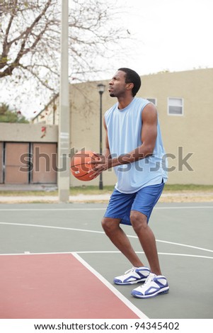 Basketball player about to throw the ball