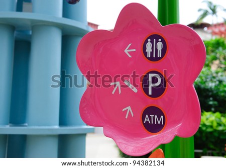Directional signs to toilet, car park and ATM