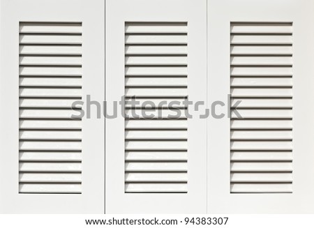Window with white wooden shutters Royalty-Free Stock Photo #94383307