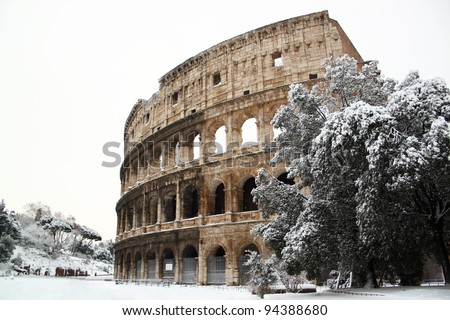 The Coliseum covered by snow, a really rare event in Rome Royalty-Free Stock Photo #94388680