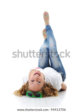 Relaxed young woman lying at home and having fun