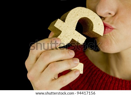 love money, woman kissing a gold pound symbol