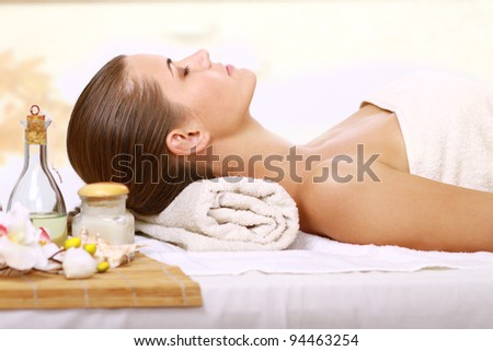 Relaxing massage for young beautiful woman in the spa salon