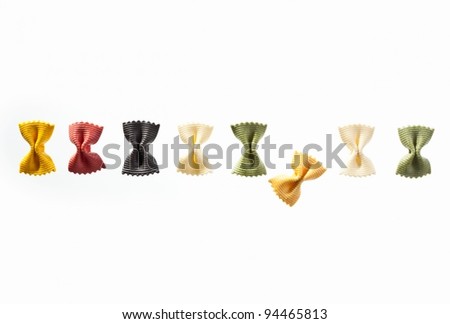 A row of noodles with different colors isolated on white background