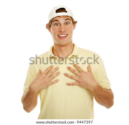 Handsome college age man gesturing to himself in surprise.  Isolated on white.