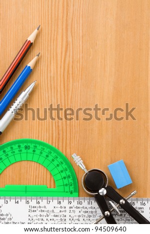 school accessories and supplies on wooden background texture