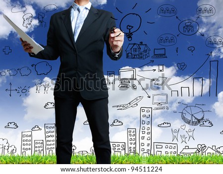businessman with marker writing something