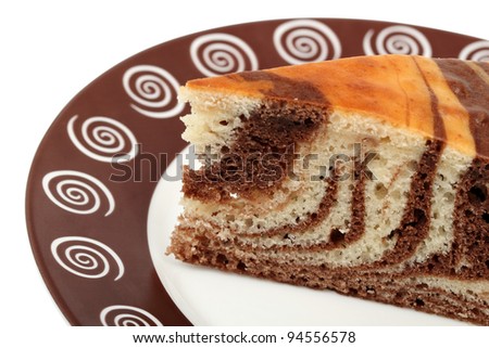 Piece of Chocolate Marble Pie on plate. Isolated with clipping path.