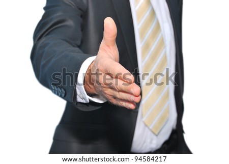  A businessman offering to shake your hand - isolated on a white background