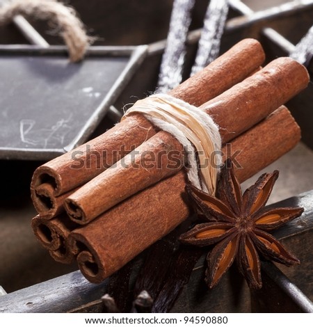 Cinnamon sticks and a memo chalkboard on a type box