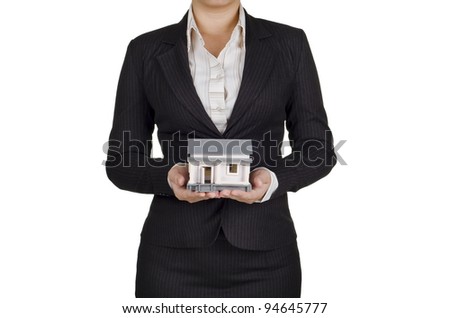 a woman real estate agent hold a house in her hands