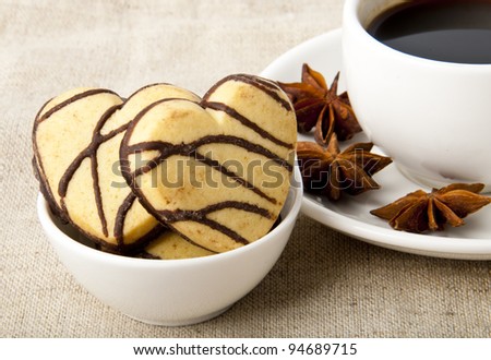 cup of coffee and cookies with chocolate