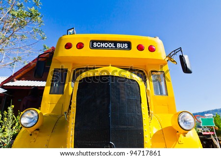 Yellow school bus against blue sky