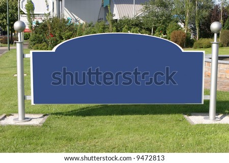 blank and wide sign with silver metal poles