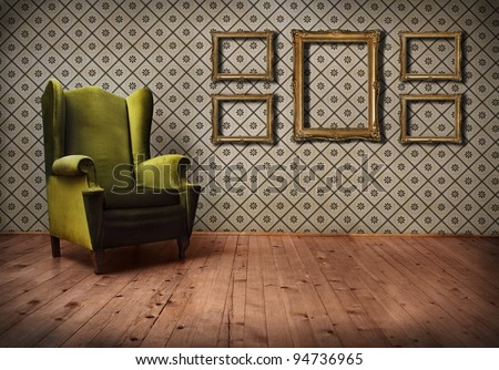 Vintage room interior with wallpaper, retro golden picture frames and old fashioned armchair. 