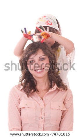 Happy family, young beautiful mother and her little daughter with color paint on white background