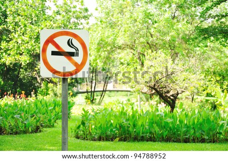 no smoking metal sign in the park