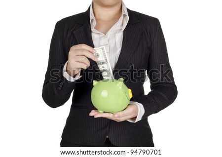 a businesswoman save money in piggy bank
