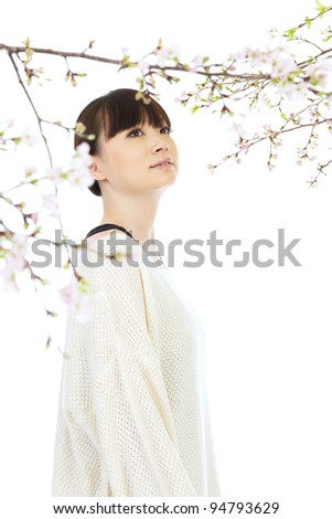 Beautiful young woman and cherry blossom
