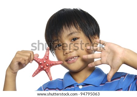 picture of lovely little girl showing starfish