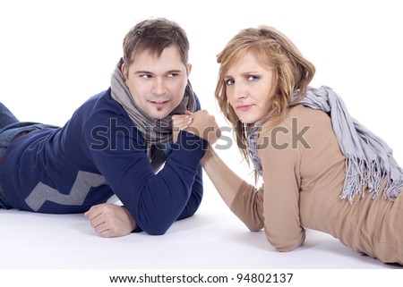 man and woman doing arm wrestling