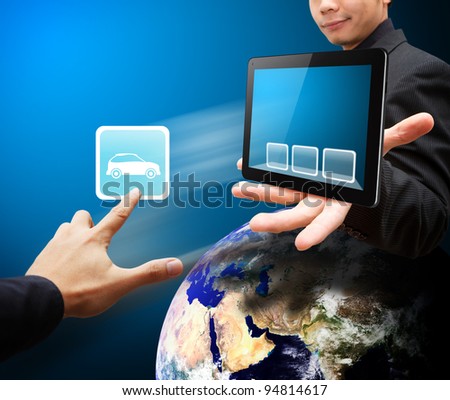 Business man hold tablet PC and touch on car icon