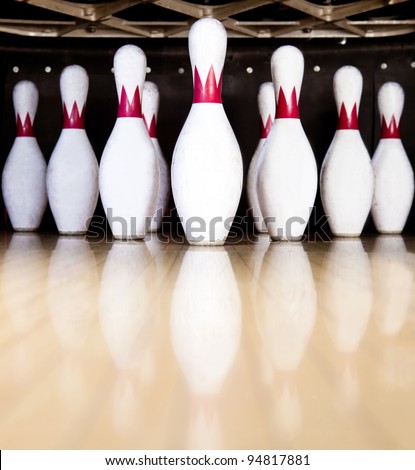 Ten white pins in a bowling alley