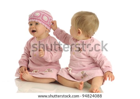 Picture of two little girls wearing same dress