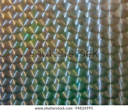Surface of stainless steel with a white pattern on top background texture