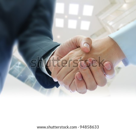 business people shaking hands  on indoor building background Royalty-Free Stock Photo #94858633