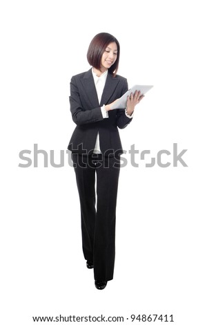 full length business woman smiling using touch pad tablet pc isolated on white background, model is a asian beauty